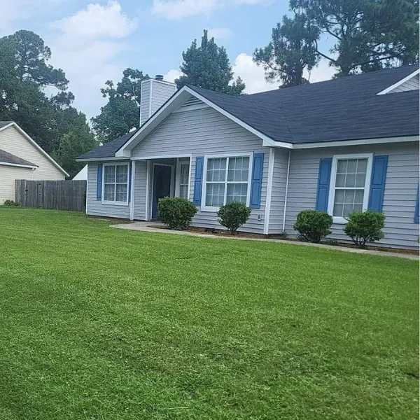 Well-maintained home exterior with a freshly cut lawn